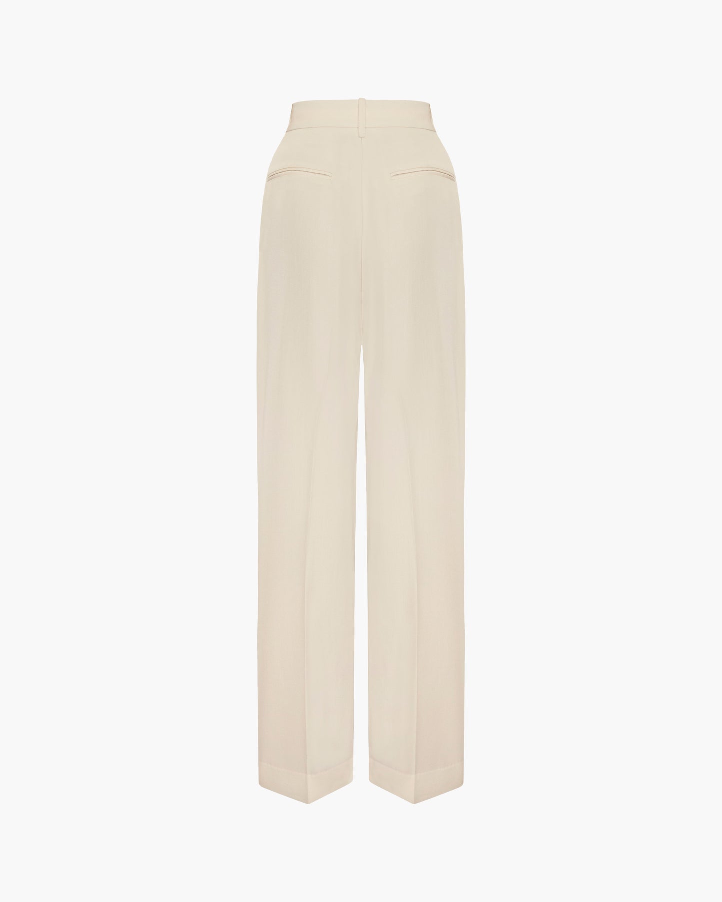 Back view of cream high-waisted wide-leg wool trousers with welt back pockets and pressed center creases, shown as a flat product shot