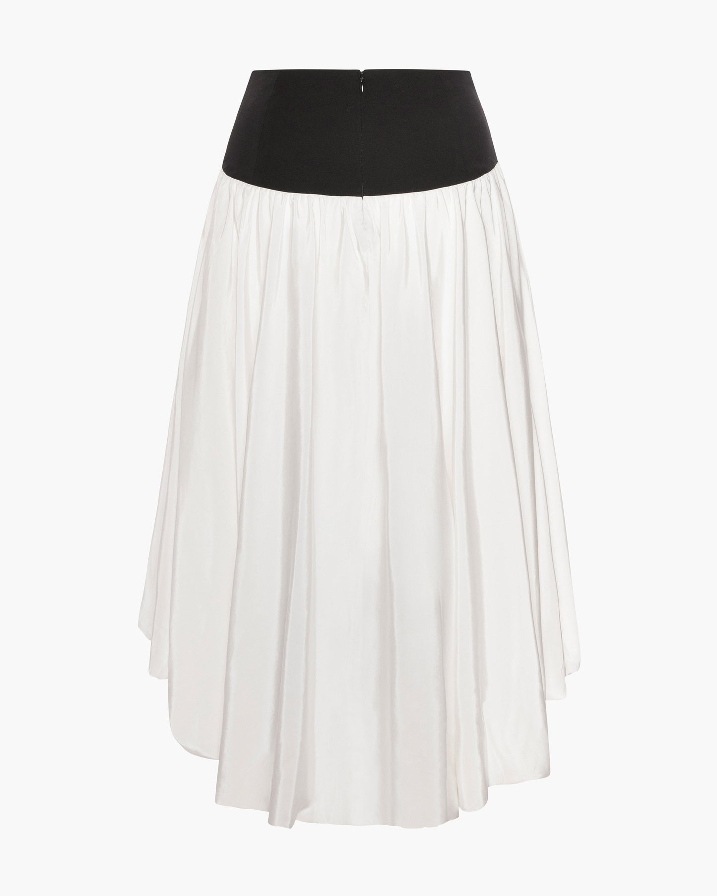 Back view of a cream high-low skirt in silky faille with a contrasting black fitted hip yoke and gathered fullness, shown as a flat product shot