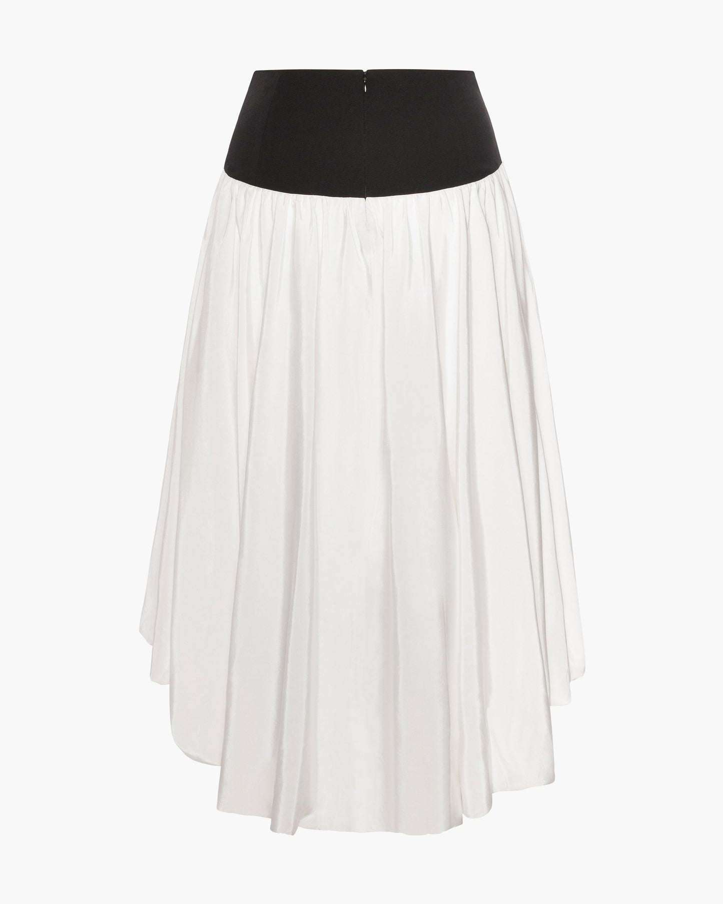 Back view of a cream high-low skirt in silky faille with a contrasting black fitted hip yoke and gathered fullness, shown as a flat product shot