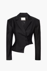 A double-breasted, herringbone virgin wool blazer with bold shoulders, notched lapels, and a curved hip cutout on a white background
