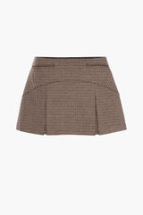 Back of a brown houndstooth mini skirt on a white background