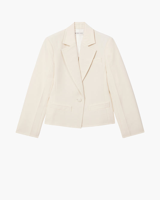 Cream blazer on a white background