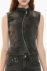 Black denim vest worn by a person on a white background