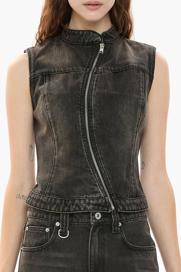 Black denim vest worn by a person on a white background