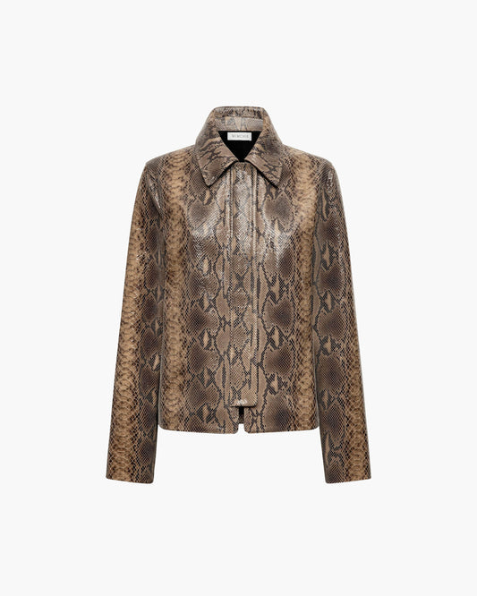 A women's long-sleeve collared jacket featuring a brown and beige snakeskin patterned leather, presented on a clean white background.