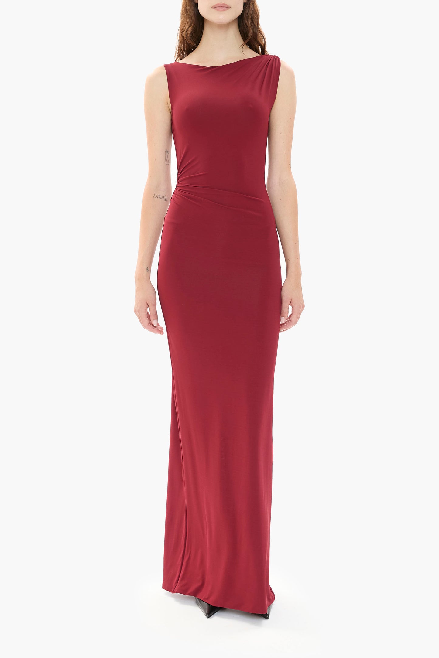 Person wearing a burgundy gown on a white background