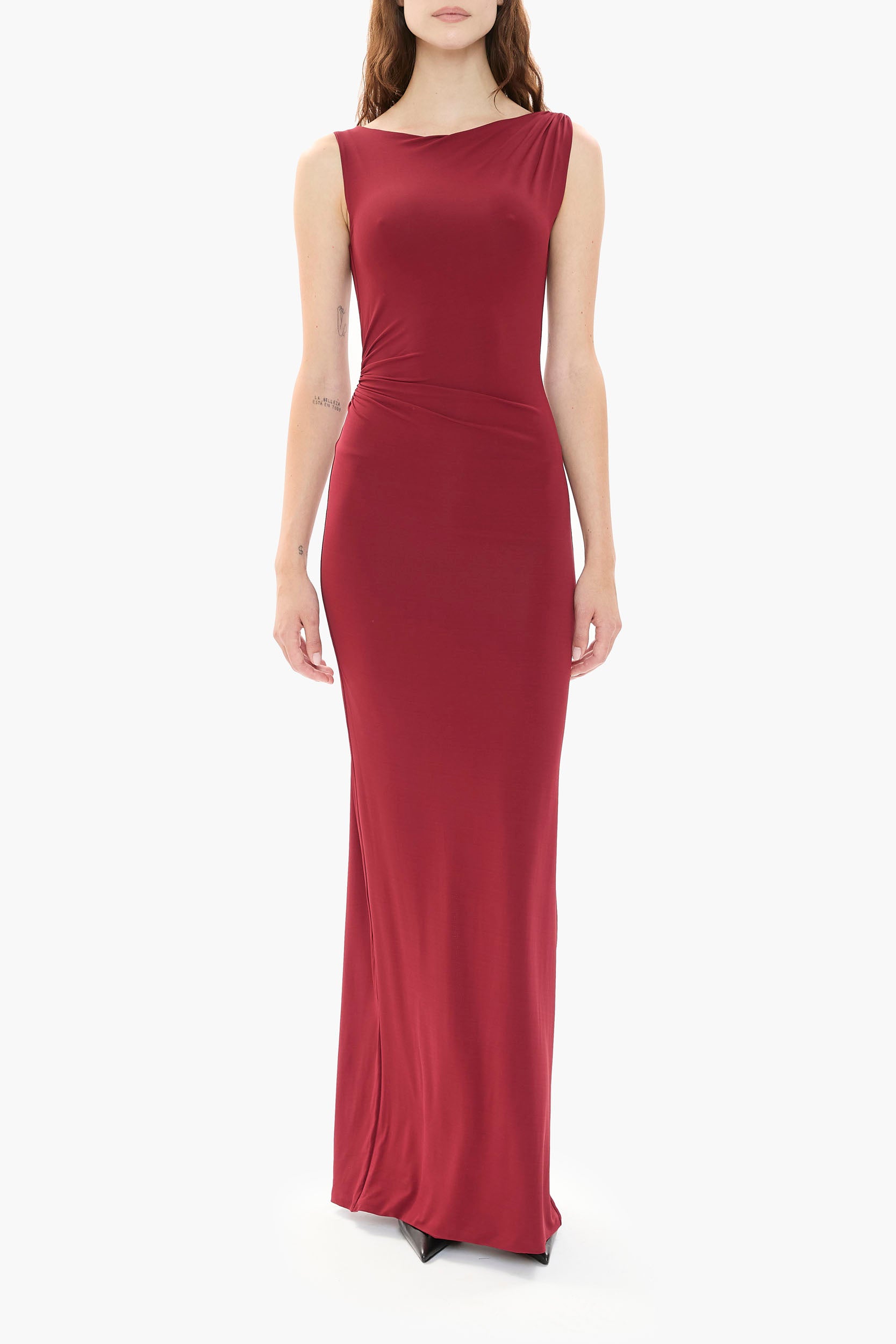 Person wearing a burgundy gown on a white background