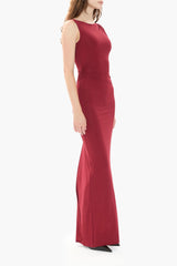 Person wearing a burgundy gown on a white background