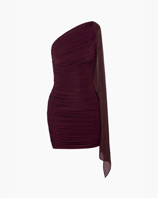 One-shoulder burgundy dress with a draped tie detail on a white background