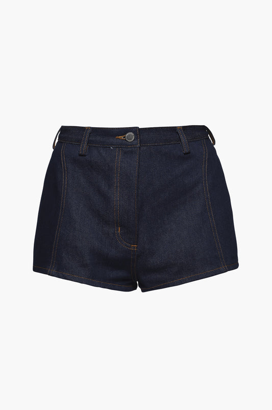 Indigo blue raw denim mini shorts on a white background