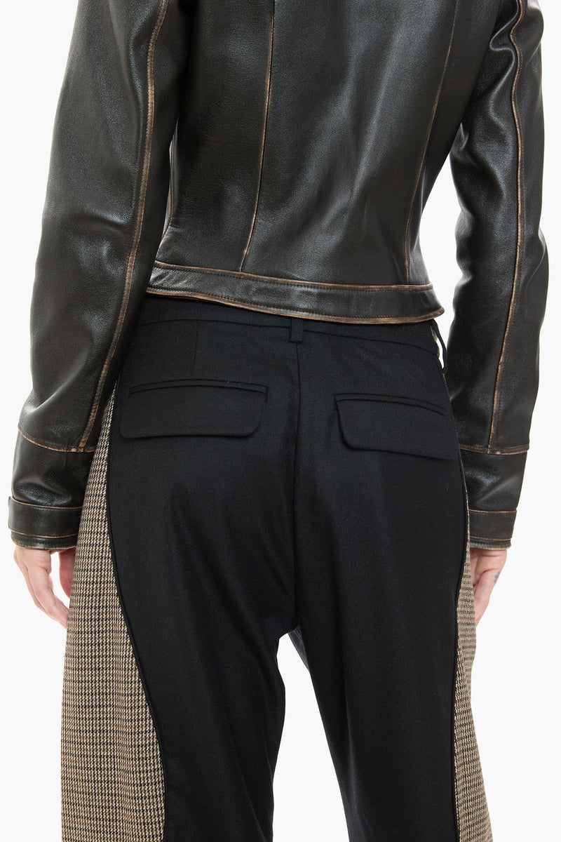 Dark brown leather jacket and black pants on a white background