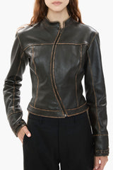 Dark brown leather jacket worn by a person on a white background