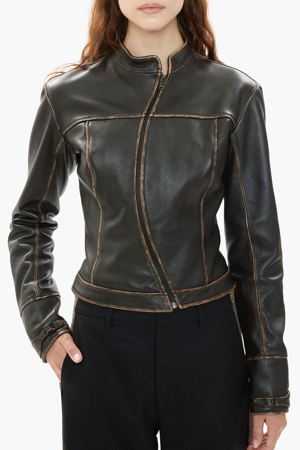 Dark brown leather jacket worn by a person on a white background