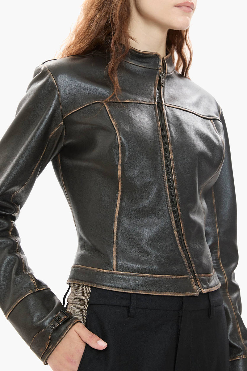 Dark brown leather jacket worn by a person on a white background