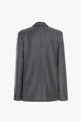Back of a gray pinstripe suit jacket on a white background