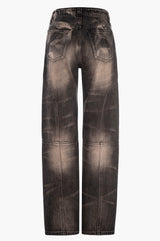 Distressed black wash jeans on a white background