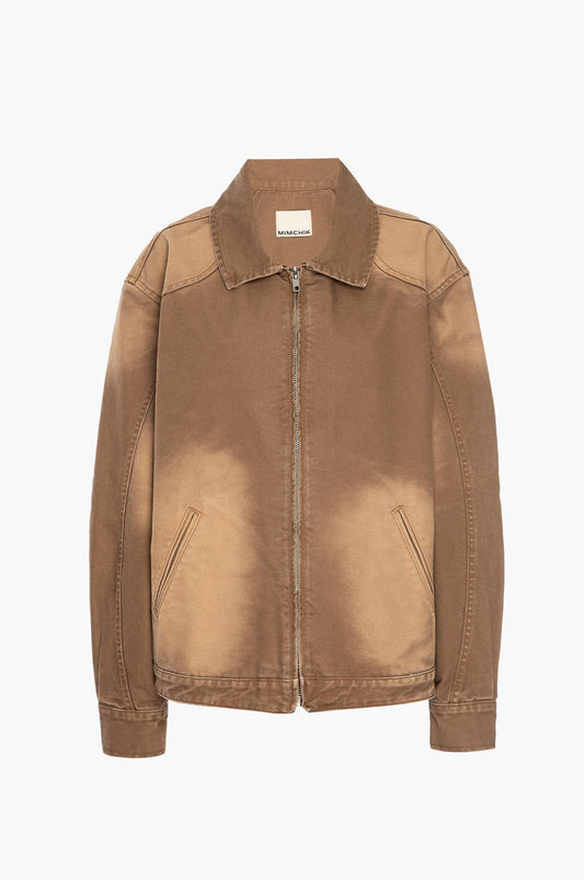 Light brown canvas jacket with a brand label on a white background