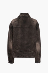 Back view of a black distressed denim jacket on a white background